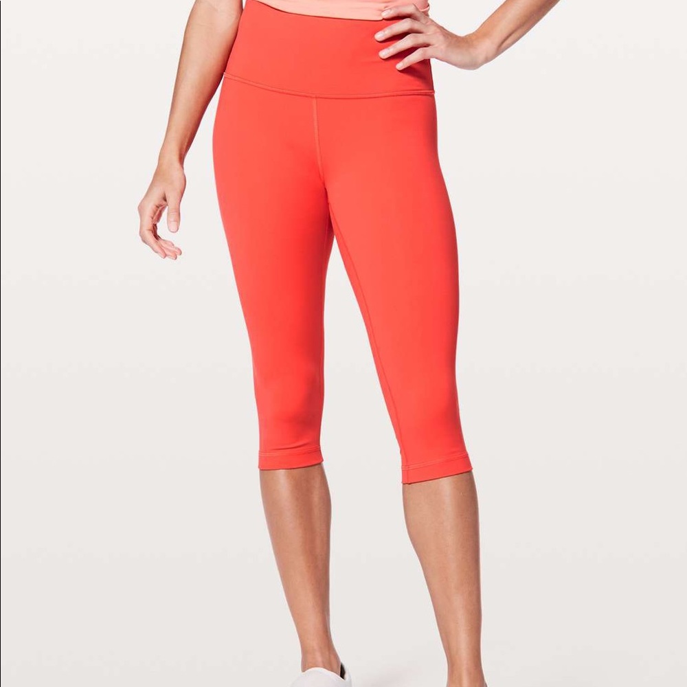 Orange Lululemon Leggings with polka dot inside